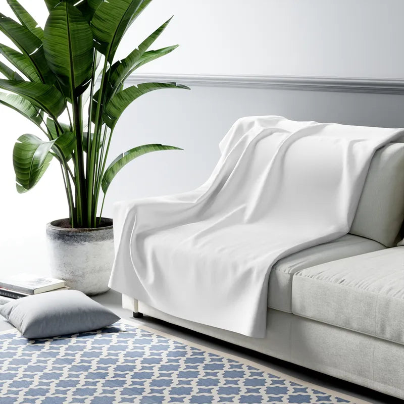 The sherpa blanket draped over a sofa (shown blank, your photo prints on the front)